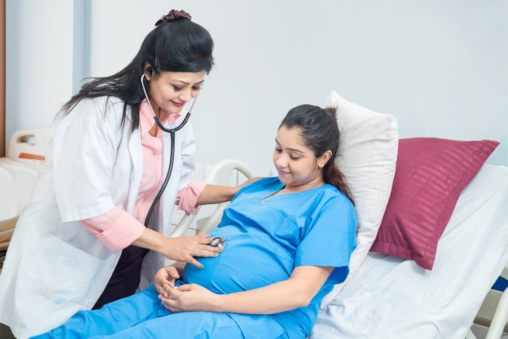 Pregnancy care consultation with gynecologist for healthy mother and baby development