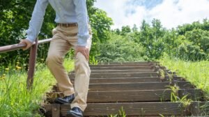 Young adult experiencing knee joint pain due to sedentary lifestyle